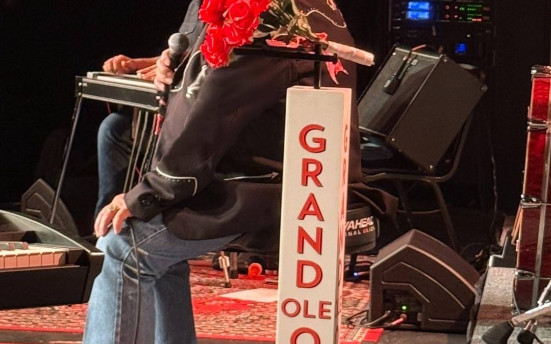 Gene Watson onstage in Benton, KY October 24, 2026 with gas can + roses gift!